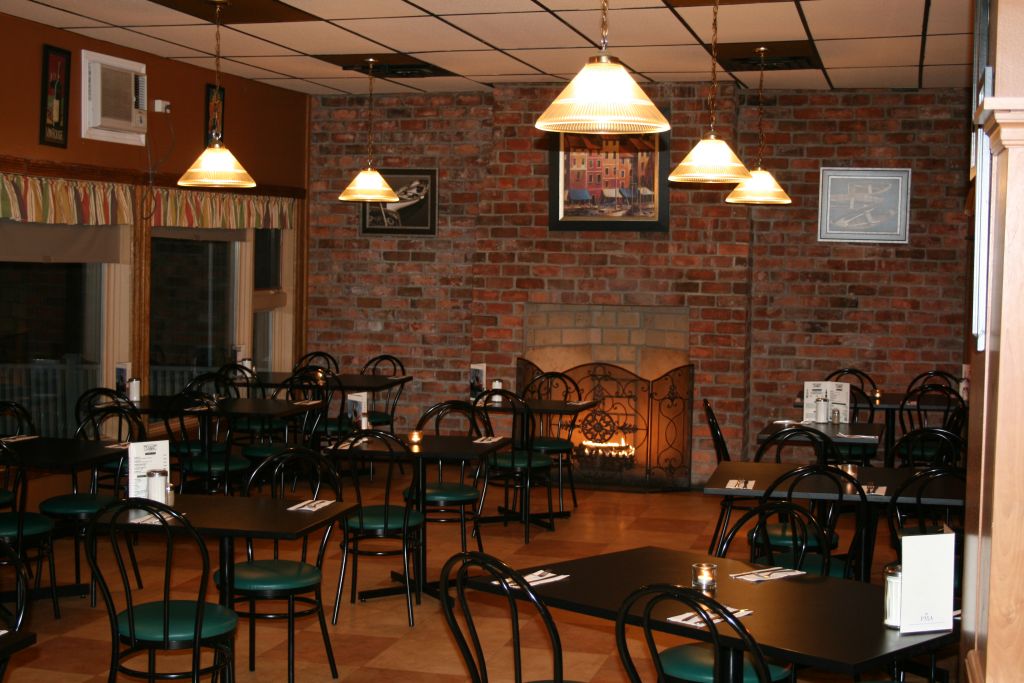 Coffee shop interior with shelves, a counter line, and a clean service area.