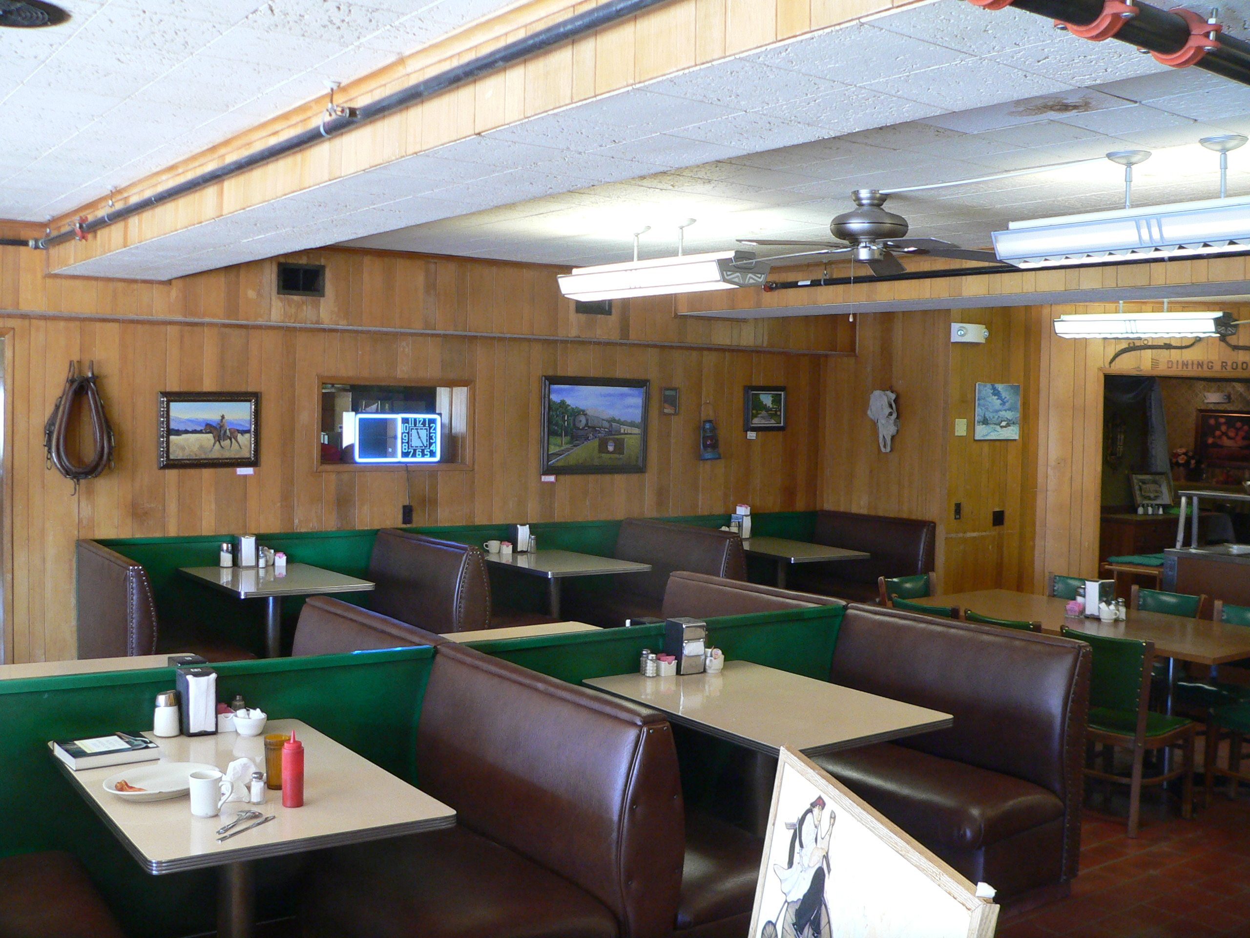 Coffee shop interior with a service counter, shelves, and a ready-to-open floor.